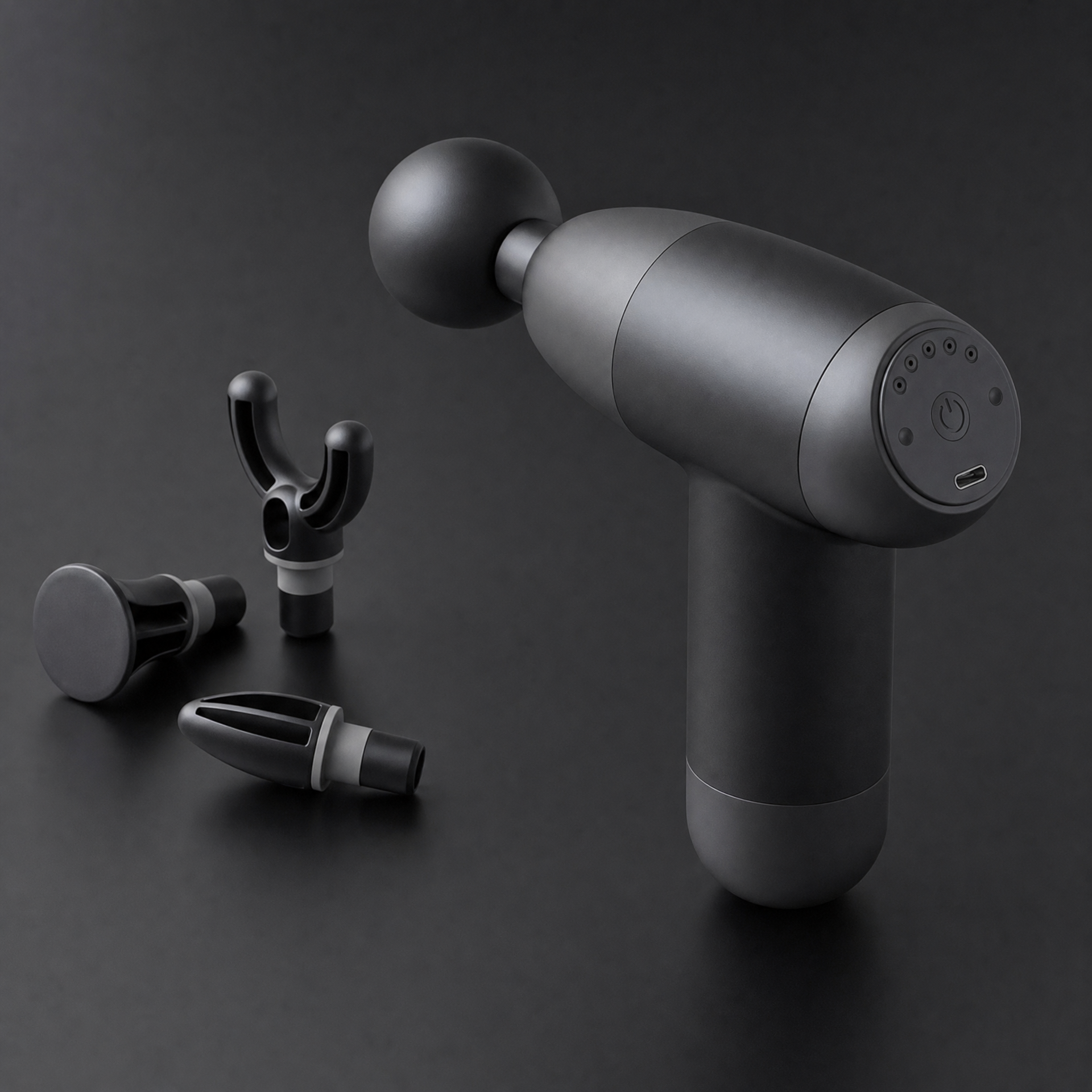 Gros plan du MyoPulse Mini et de ses trois embouts de massage interchangeables